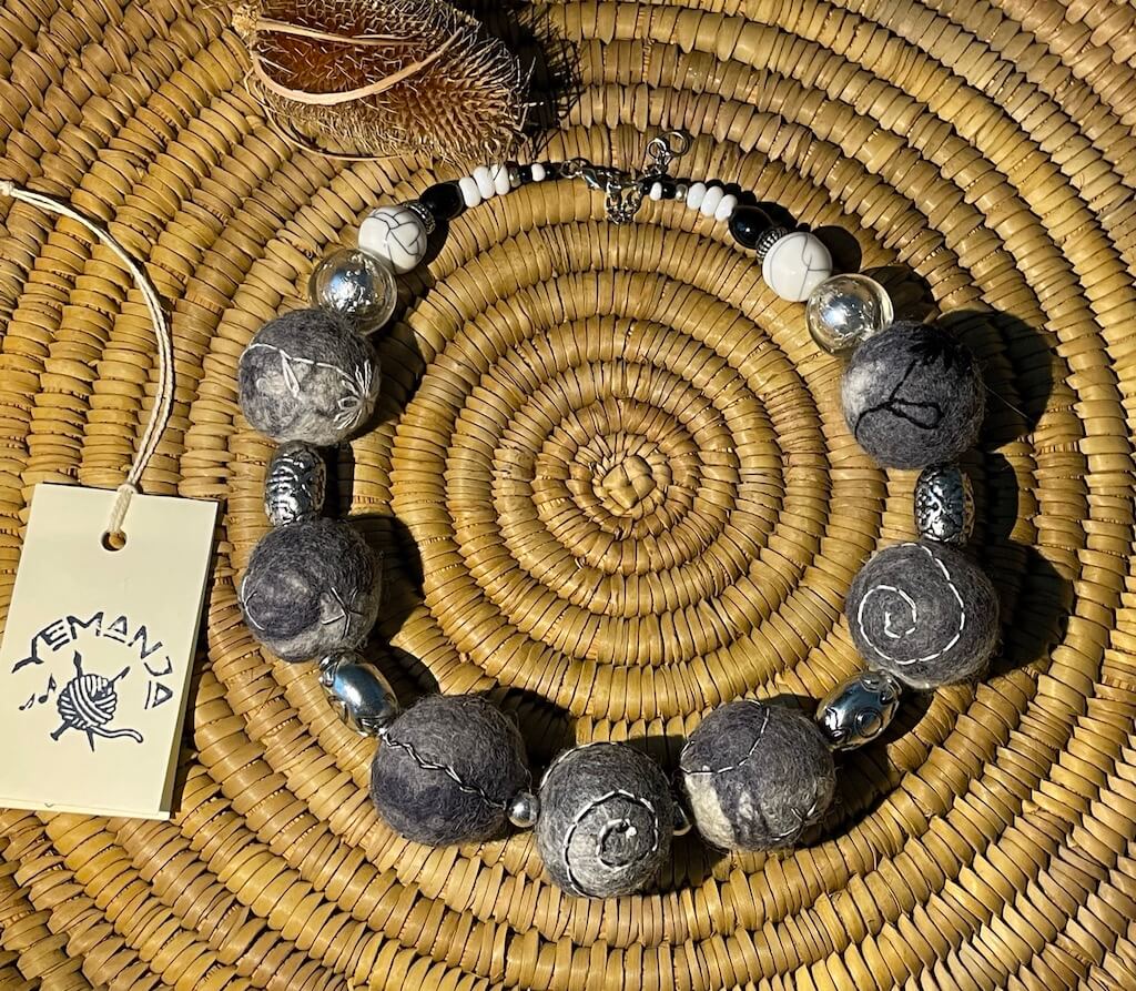Necklace with felted beads, in shades of grey